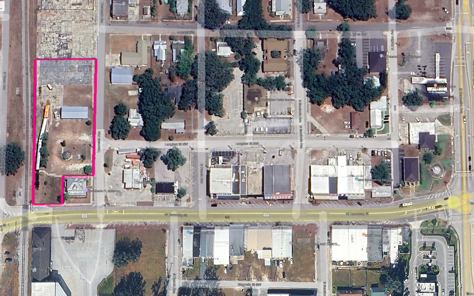 Aerial of downtown Fort Meade along West Broadway (US-17), with the historic train-car site outlined — the study area for the visioning renderings. BusinessFlare®.